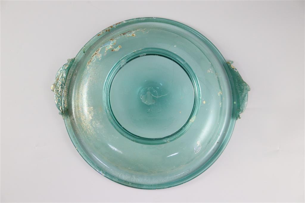 A Roman green glass dish, 1st/2nd century AD, 33cm across